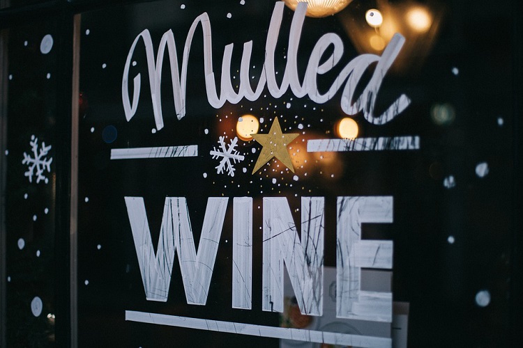 A window graphic depicting a mulled wine advertisement