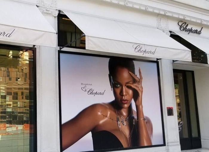 A custom adhesive vinyl sign in a store window