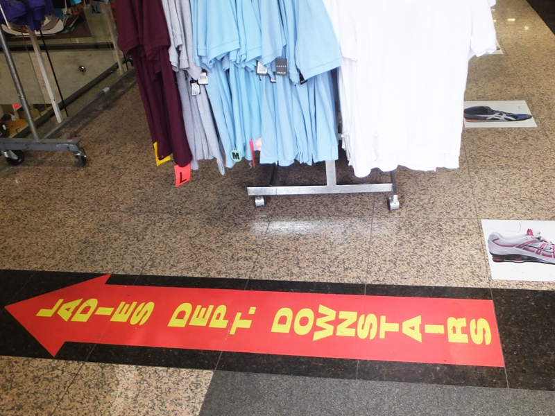 Large floor decal showcasing the ladies’ department in a retail store.