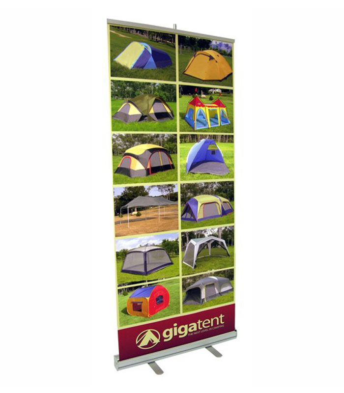 A retractable banner with a colorful graphic showcasing camping tents.