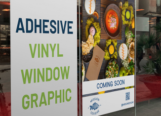 Self-adhesive vinyl high-quality printed banner displayed on a glass storefront window