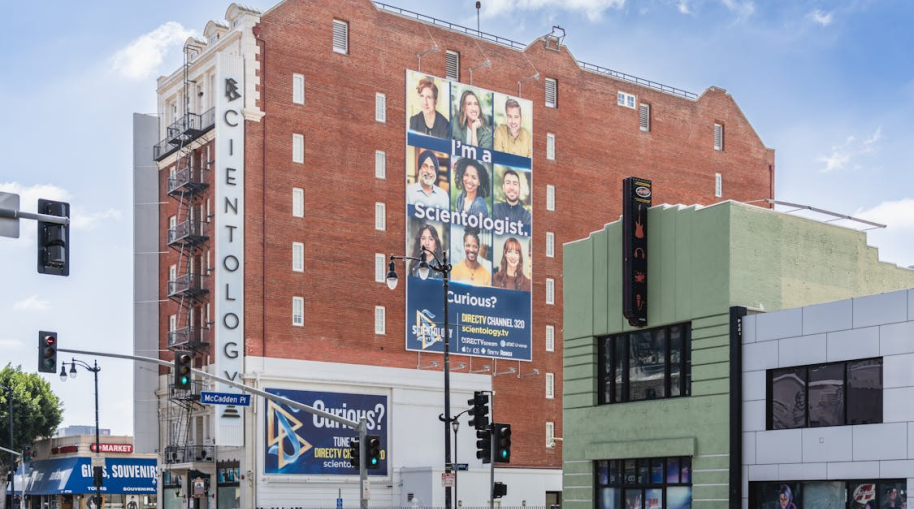 A vibrant, high-resolution,large-format printed banner on a wall promoting a local business
