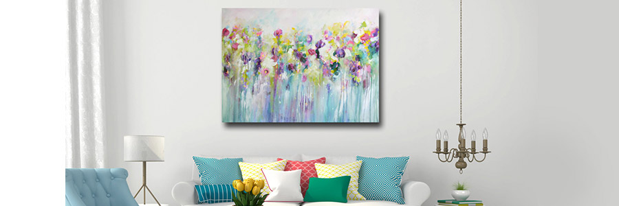 A floral canvas painting on a wall behind a couch