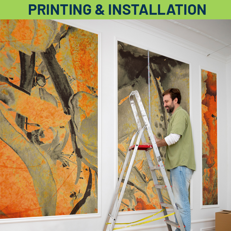 a man on a ladder putting up a poster