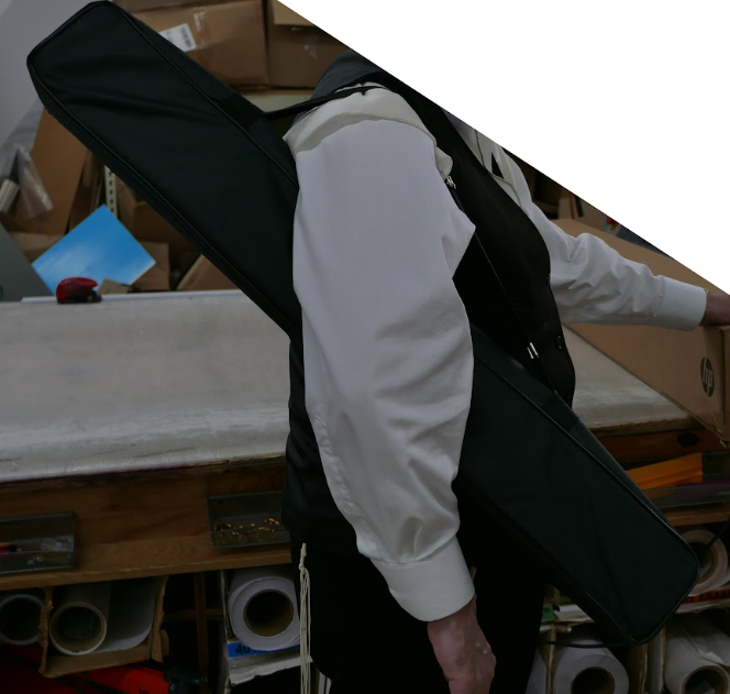 A person carrying a retractable banner.