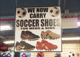 Promotional graphic featuring soccer shoes in a retail-style display