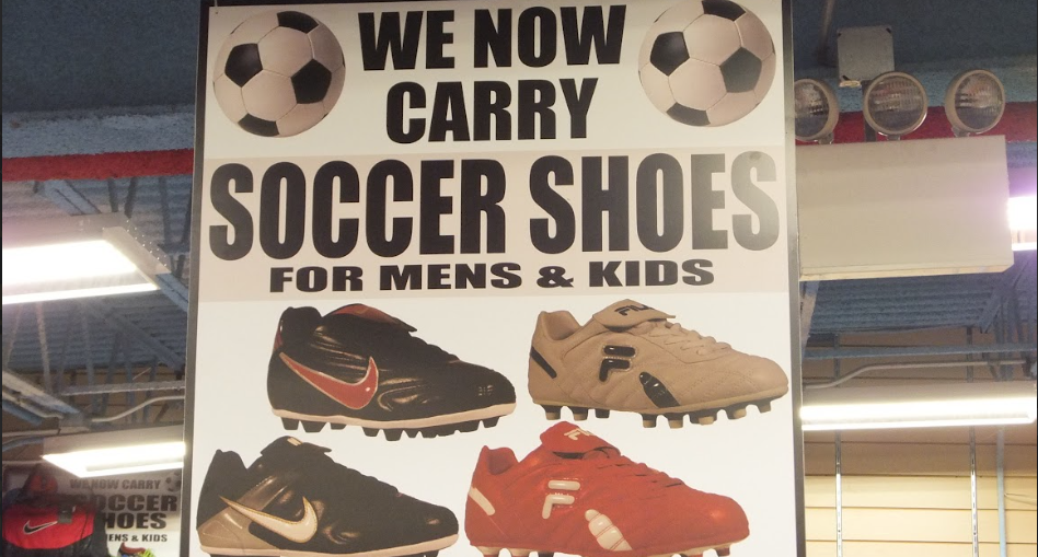 Promotional graphic featuring soccer shoes in a retail-style display