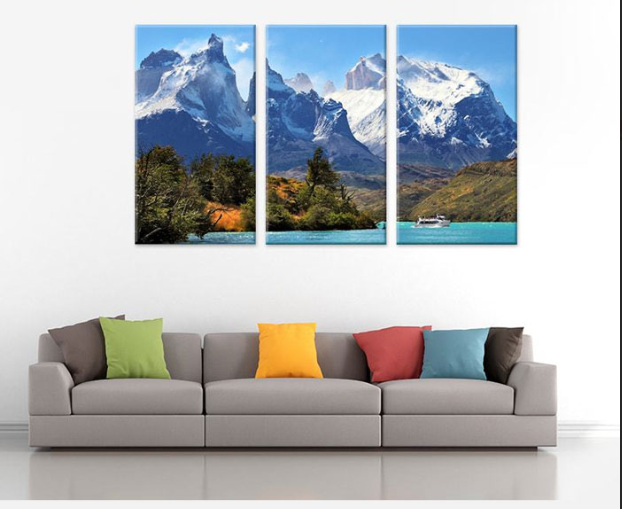 Custom canvas prints displayed on a wall showing vibrant gallery-quality artwork for interior branding