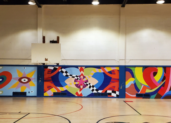 A large indoor wall graphic printed on adhesive vinyl installed in a commercial interior space