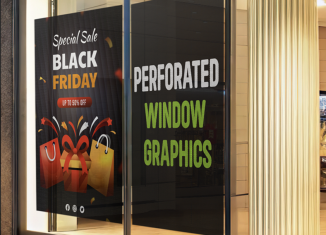 Large printed promotional window graphics applied across a retail storefront