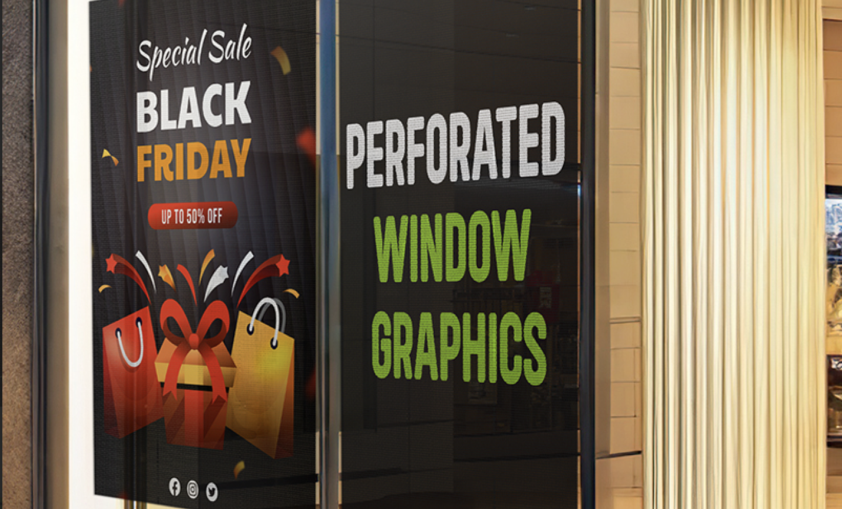 Large printed promotional window graphics applied across a retail storefront