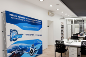 Straight pop-up display wall with large format graphics in a technology office