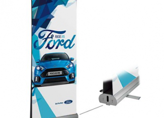 Branded trade show booth with pop-up display, retractable banners, and custom table covering