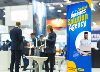 Retractable trade show banner using oversized headline typography and strong color contrast