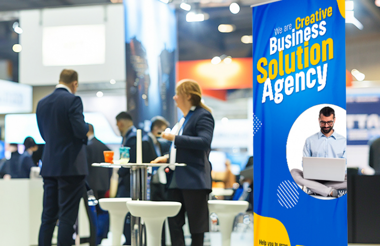 Retractable trade show banner using oversized headline typography and strong color contrast