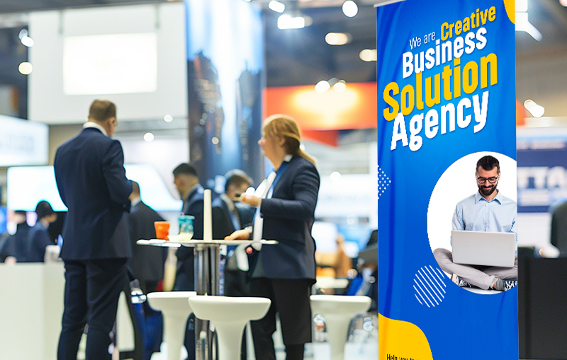 Retractable trade show banner using oversized headline typography and strong color contrast