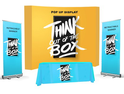 Trade show display package with pop-up backdrop, retractable banners, and branded table covering