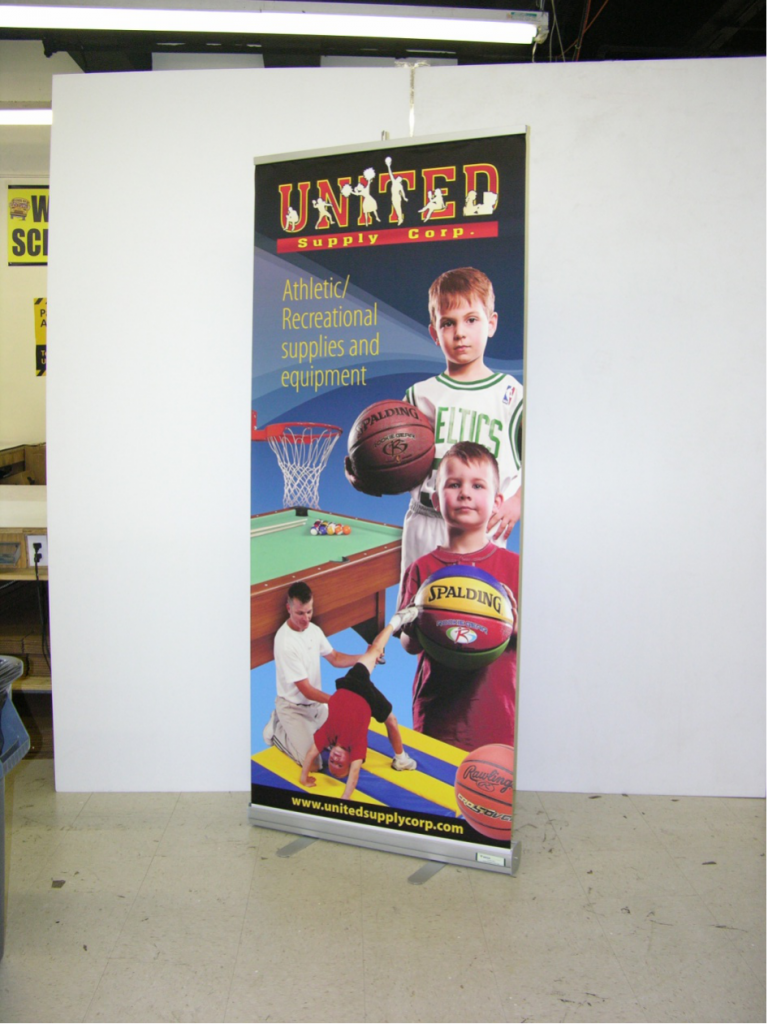 Youth basketball retractable banner featuring young athletes
